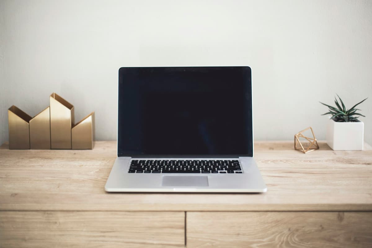 Focused laptop workspace for AI prompt practice